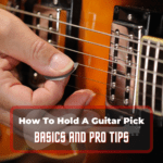 how to hold a guitar pick